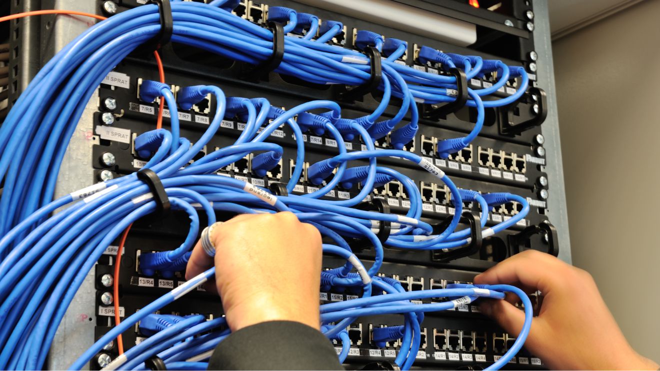 person managing network cables