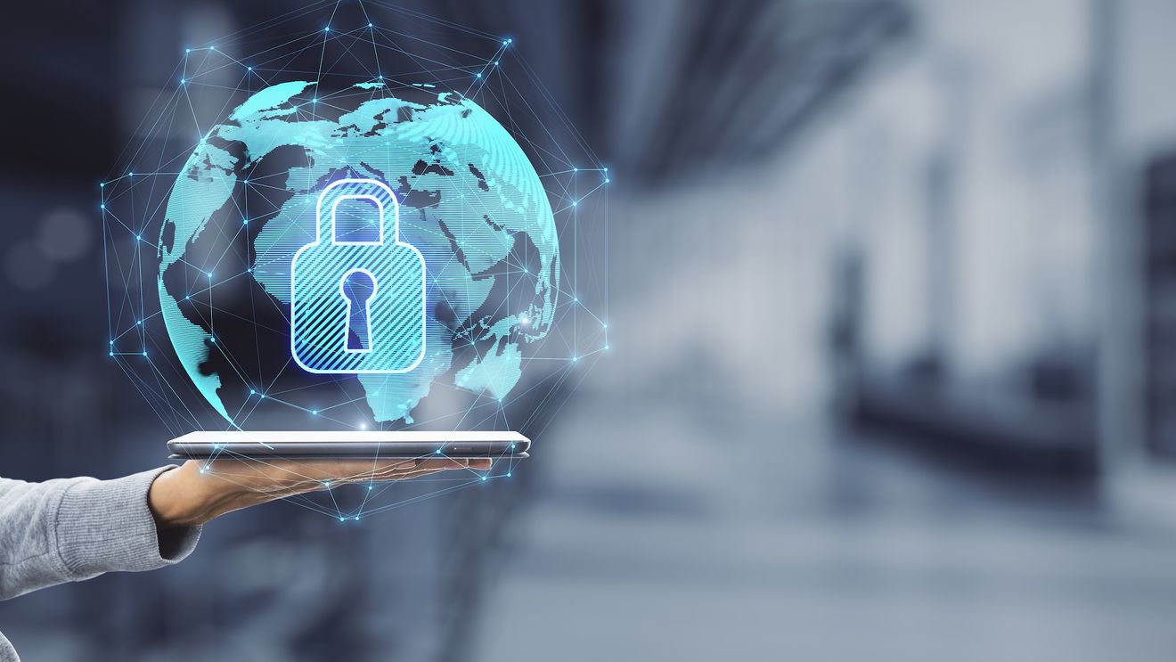 Cybersecurity concept showing a digital lock over a global network on a tablet device