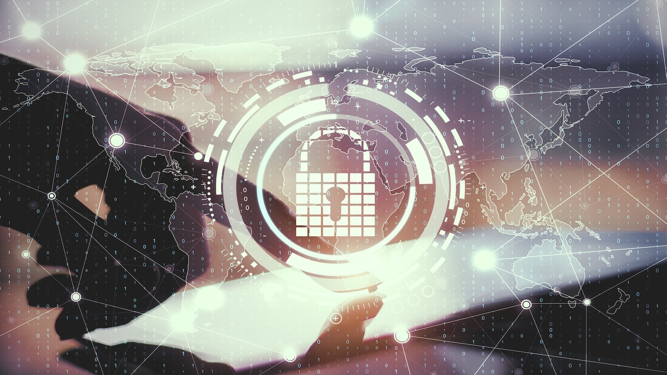 Close Up Of Hands Using Tablet With Creative Glowing Digital Padlock Interface On Blurry Background