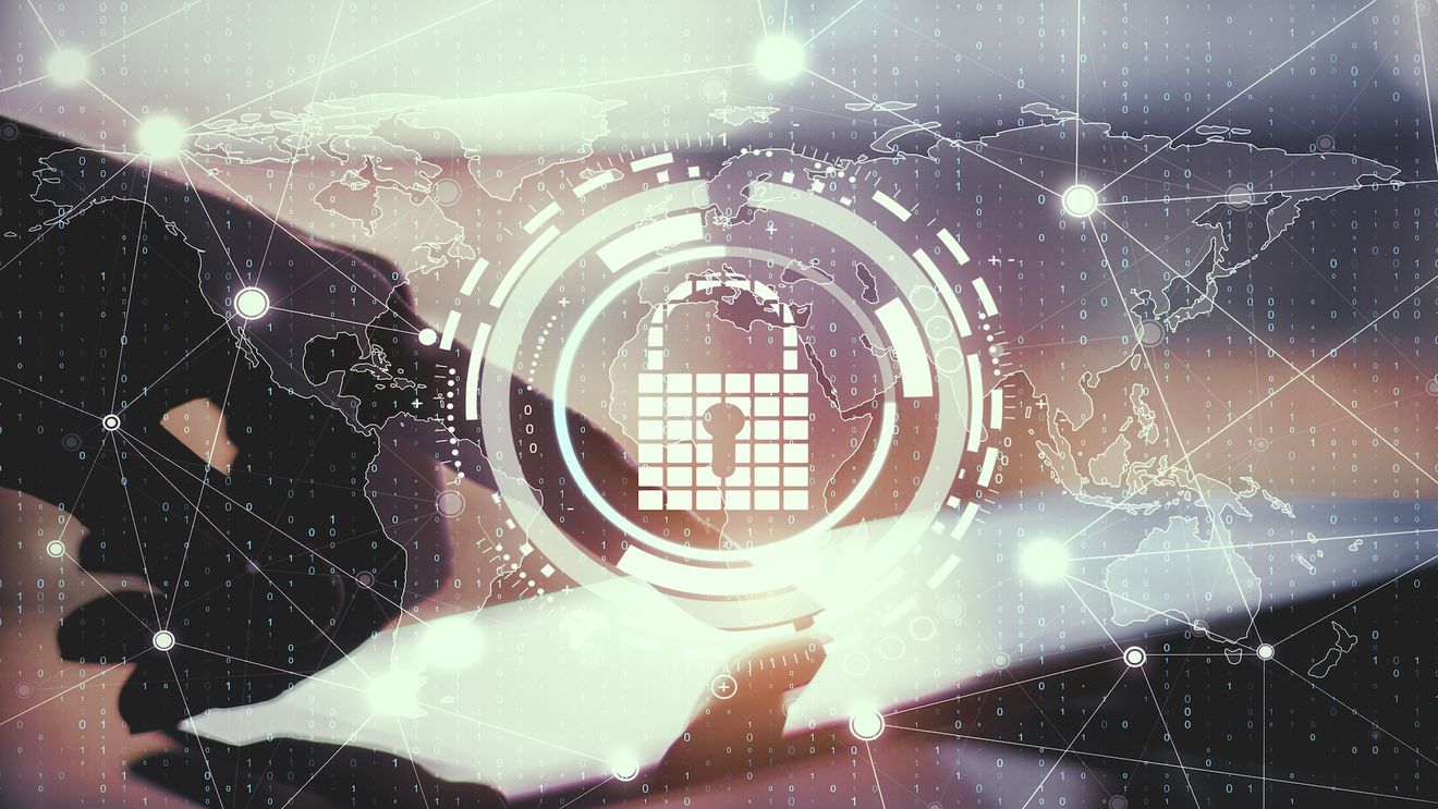 Close Up Of Hands Using Tablet With Creative Glowing Digital Padlock Interface On Blurry Background