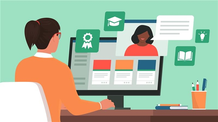 woman at computer monitor looking at platform